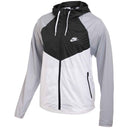 Gray and black Nike jacket with a hood on a white background