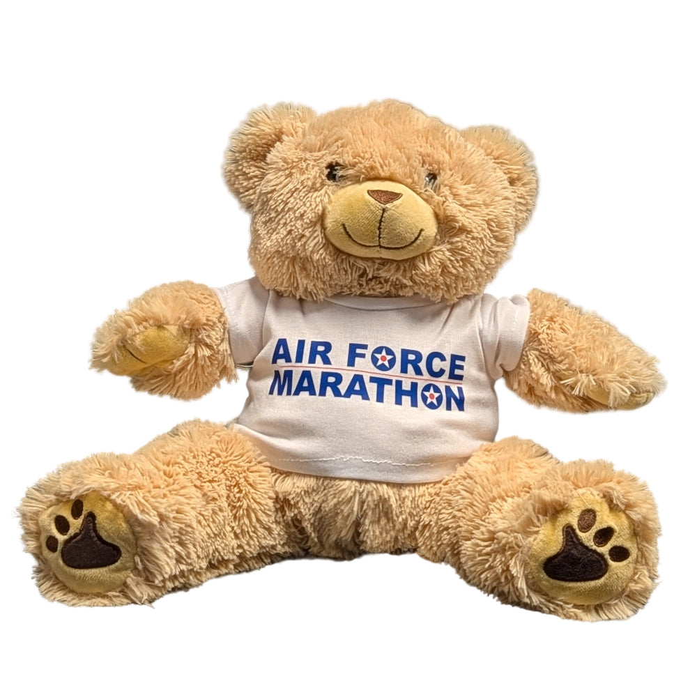 Teddy bear wearing a 'Air Force Marathon' t-shirt on a white background