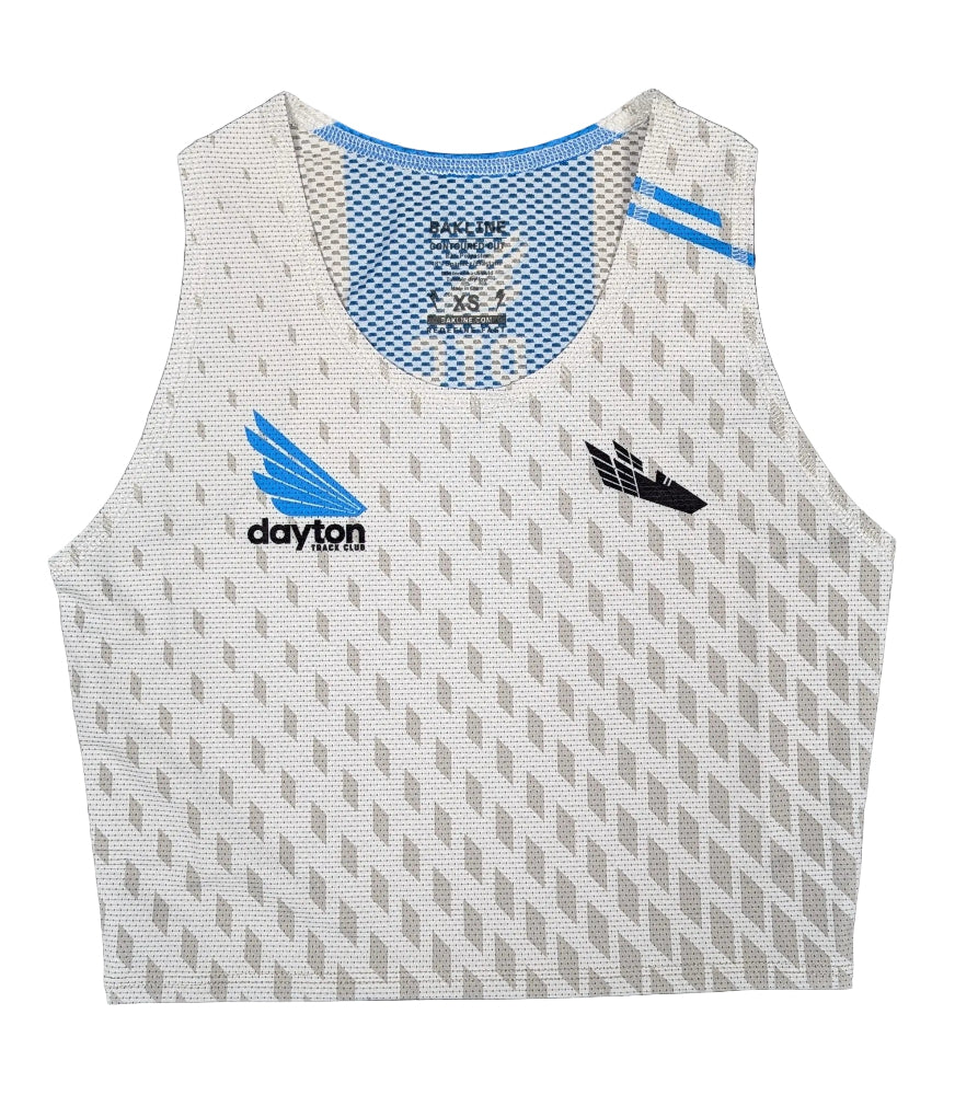 White athletic tank top with blue and black branding on a dark wooden surface